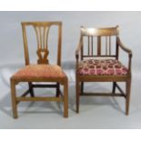 A George III style oak dining chair with pierced waisted splat, drop in seat, on chamfered square