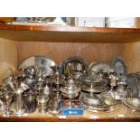 A large quantity of silver plated ware to include part tea services, goblets, hot water jugs, trays,