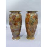 A pair of Royal Doulton stoneware vases, decorated with impressed leaves in an autumnal glaze,