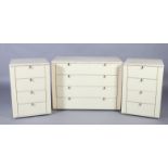 A pair of Interlubke marble top cream melamine veneered chests of four drawers, together with a