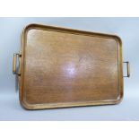 An Edwardian oak and brass two handled tray 67cm over handle x 42cm