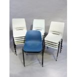 Fifteen blue, grey and pale blue stacking chairs, on black tubular metal frames