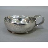Turn of the century silver taste vin, circular with strapwork handle, engraved Conon Moree F