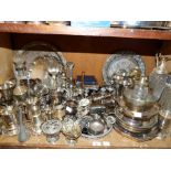 A large quantity of silver plated ware to include carafes, decanters, trays, goblets, coffee