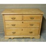 A late Victorian strip pine chest, the rectangular top with moulded lip above two short and two long