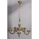 A brass five branch scrolling arm chandelier, 43cm diameter approximately