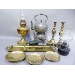 A pair of Victorian brass candlesticks, a brass oil lamp, a Britannia metal spirit kettle and