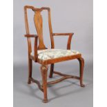 An Edwardian figured mahogany elbow chair, the vase shaped splat inlaid with parquetry stringing,