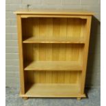 A reproduction pine open bookcase, 83cm wide x 110cm high x 27.5cm deep