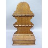 An oak spoon rack with candle box, 55cm H x 31cm W