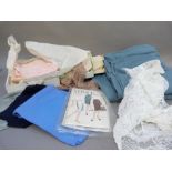 A quantity of dress and lingerie fabric inc, a duck egg blue wool cloth and a vintage Vogue skirt