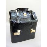 A vintage black mock crocodile skin beauty case in the style of Hermes, lined in moiré silk, the