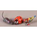 A Tri Ang Minic clockwork plastic ladybird, 8.5cm long; a painted tinplate clockwork bird with