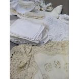 A quantity of mixed table linens including napkins, doylies, table cloths etc