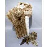 A mink stole in original box; together with a mink tie