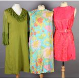 Three mini dresses circa 1960's to include two sleeveless shift dresses in orange and turquoise/