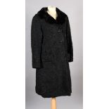 A Persian lamb coat with black fur collar with button fastening and pocket cuffs