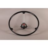 Motoring: A Morris Minor Banjo type three spoke steering wheel with horn push, plastic rim, 41.5cm