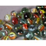 Quantity of Vintage marbles mainly Cats Eye type, multi-coloured, yellow and red (approx 38)