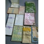 A quantity of new and unused household linens including pillow and bolster sets, towels, throws,