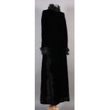 Henry Burger Couture, a black velvet full length evening gown, 1960s-1970s, feather-cut chiffon neck