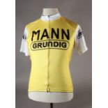 A polyester cycle jacket, the front and arms emblazoned Mann Grundig, size L