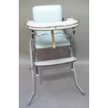 A Tubemaster Iris child's high chair with chromium plated frame, blue vinyl seat and black and