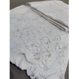 A white floral embroidered table cloth with drawn thread border 180cm x150cm approximately; together