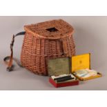 A wicker fishing creel and a quantity of vintage line in original packaging to include Albert