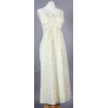 Christian Dior, a lace edged and inset full length nightgown with shoestring straps, in pale