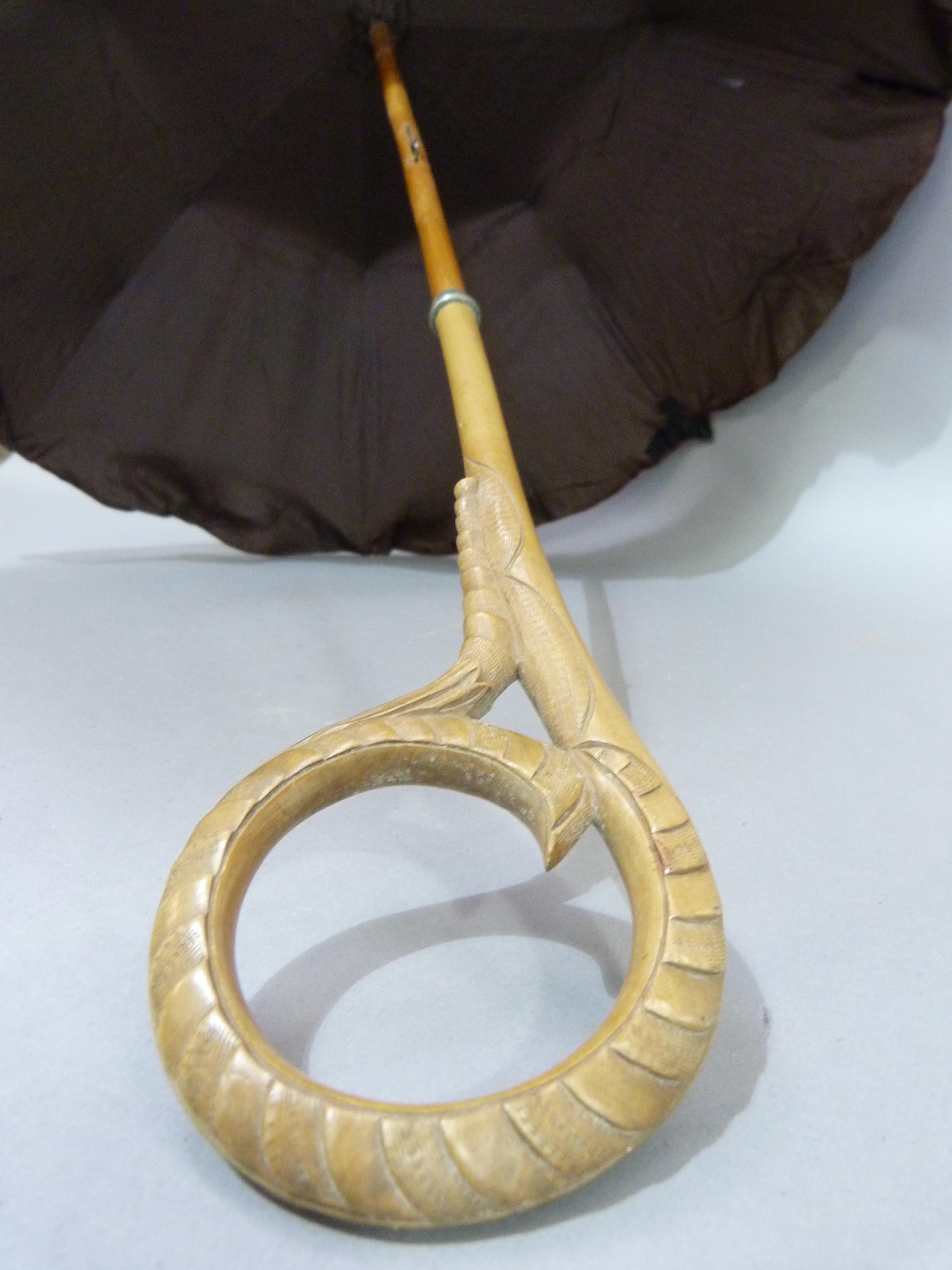 A Late Victorian aubergine satin parasol, the handle finely carved in a loop - Image 2 of 3