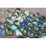 Quantity of Vintage marbles mainly Cats Eye type, light blue, white, yellow and green, some small (