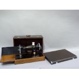 A vintage Singer hand sewing machine, in case, serial no. ED018306