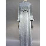 A sliver lurex full length evening dress with bow detail and long sleeves, size 16