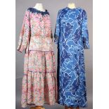 A maxi dress, late 1960's, in navy and white polyester, size 18, a pink /green/orange printed cotton