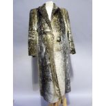 An Iceland seal skin coat with shawl collar, single button fastening and slit pockets