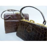 A chestnut brown crocodile skin handbag with twin handles, with back pocket; together with a