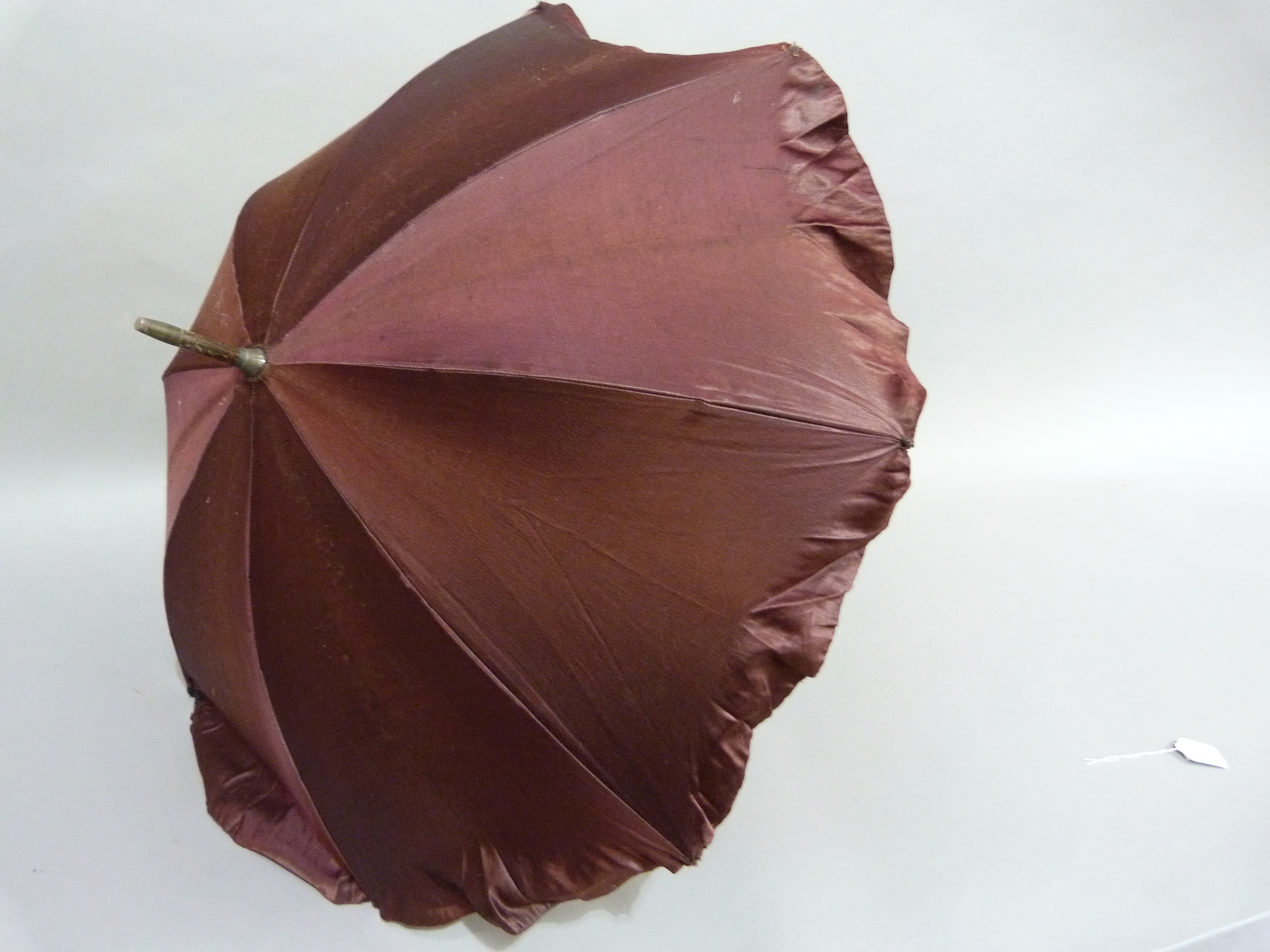 A Late Victorian aubergine satin parasol, the handle finely carved in a loop - Image 3 of 3