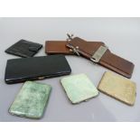 Three shagreen covered cigarette cases, a black lizard skin cigarette case and a black crocodile