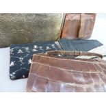 A 1940's crocodile skin clutch bag together with a snake skin clutch bag, a black silk and beaded