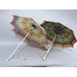 A vintage rainbow coloured rayon parasol, the cream shaft with spherical finial painted with a