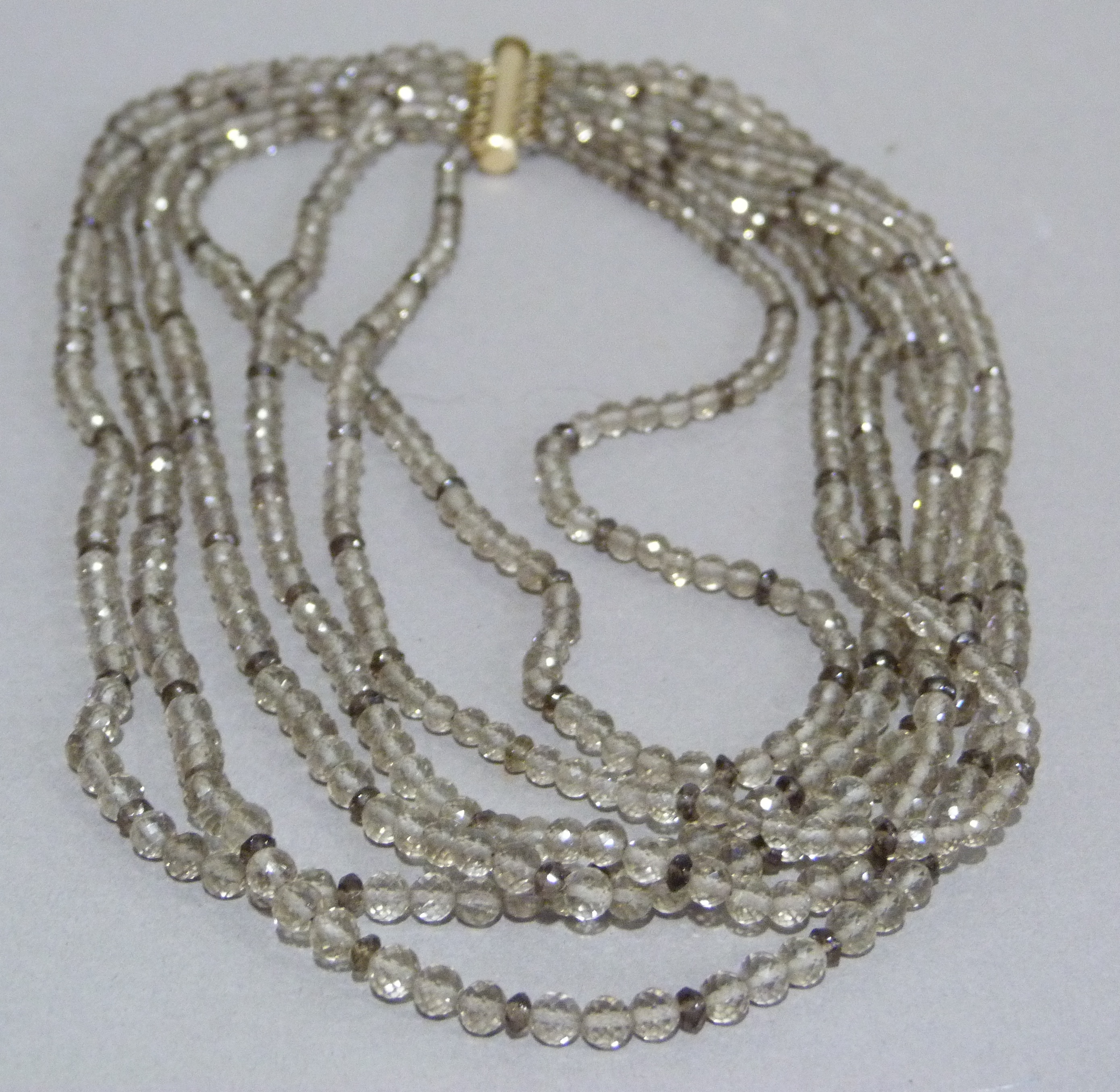 A multi strand necklace of graduated facetted smoky quartz beads with rolled gold fittings, - Image 2 of 3