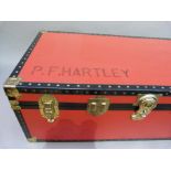 Large red and black trunk, modern, 92cm wide x 49.5cm deep x 35cm high, named P.F. Hartley