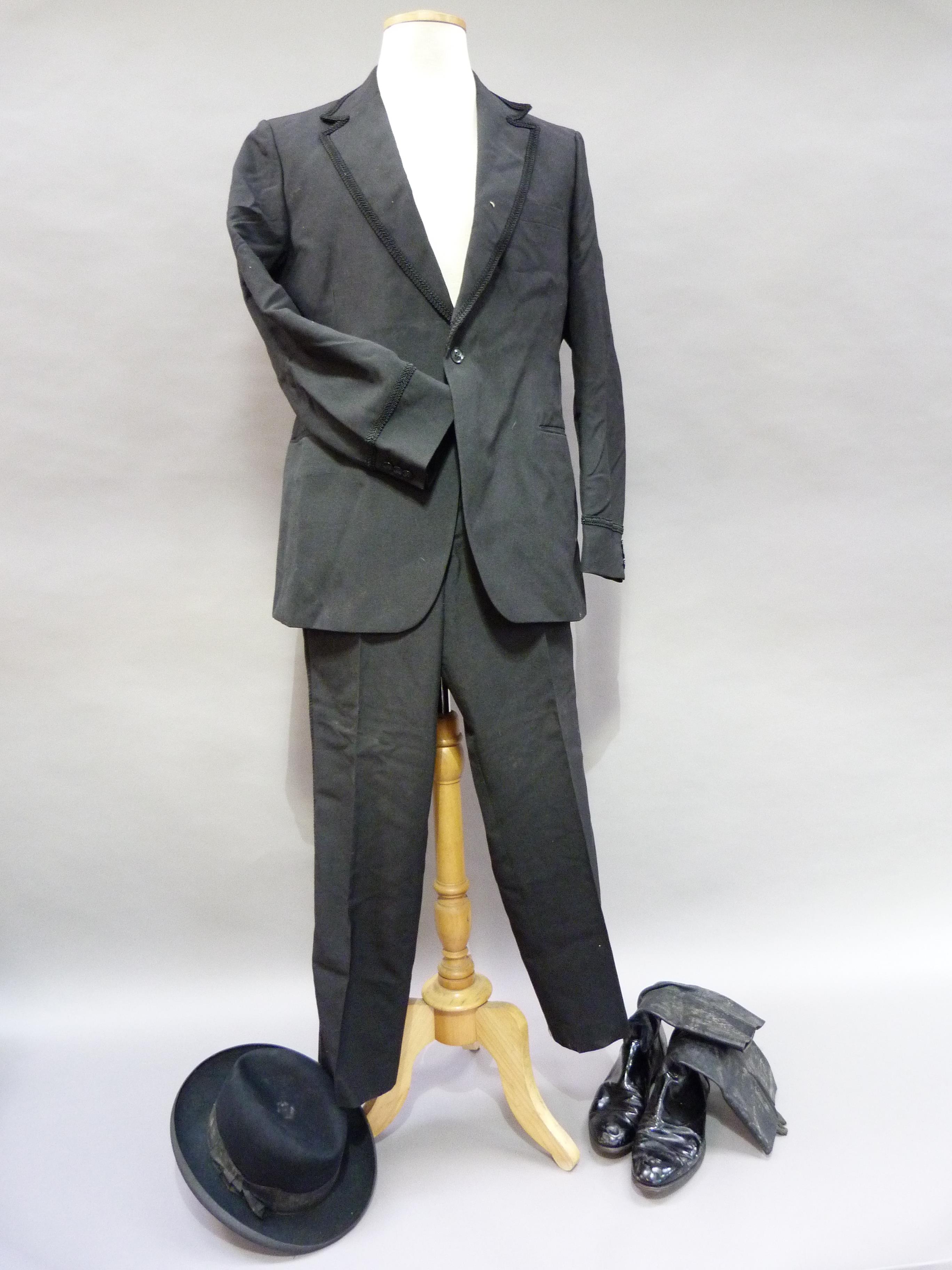 An Austin Reed dinner jacket and trousers, Circa 1970's together with a pair of black leather