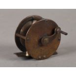 Fishing: a small English brass fly reel with brass foot, 2", late 19th/early C20th