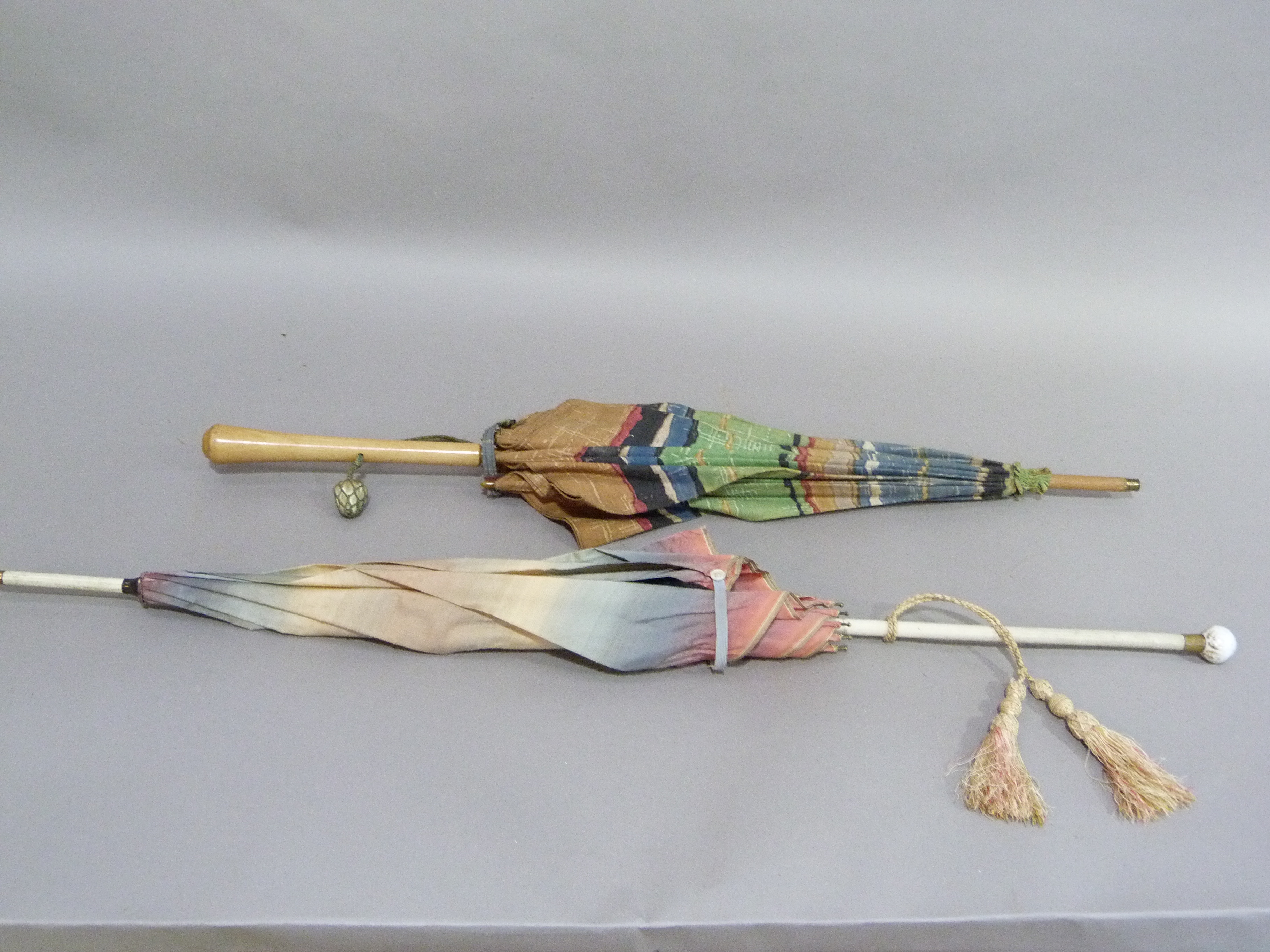 A vintage rainbow coloured rayon parasol, the cream shaft with spherical finial painted with a - Image 3 of 4