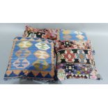 A pair of kilim cushions in blue and coral and a further pair in grey, ivory, black and red, plain