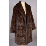 A dark brown died squirrel jacket with shawl collar