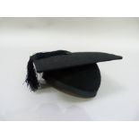A graduation mortar board by Ede and Ravenscroft, of Chancery Lane, London