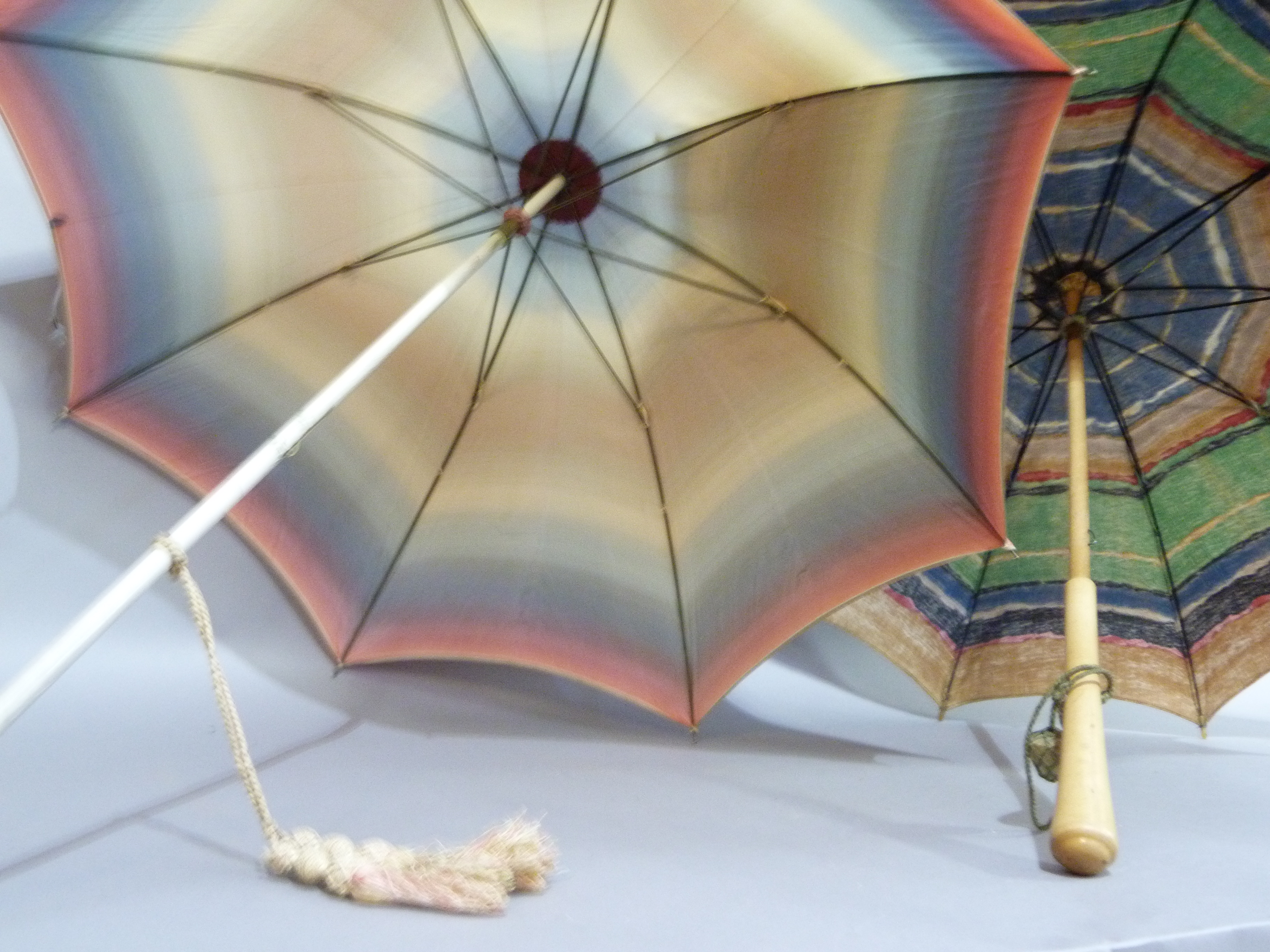 A vintage rainbow coloured rayon parasol, the cream shaft with spherical finial painted with a - Image 4 of 4